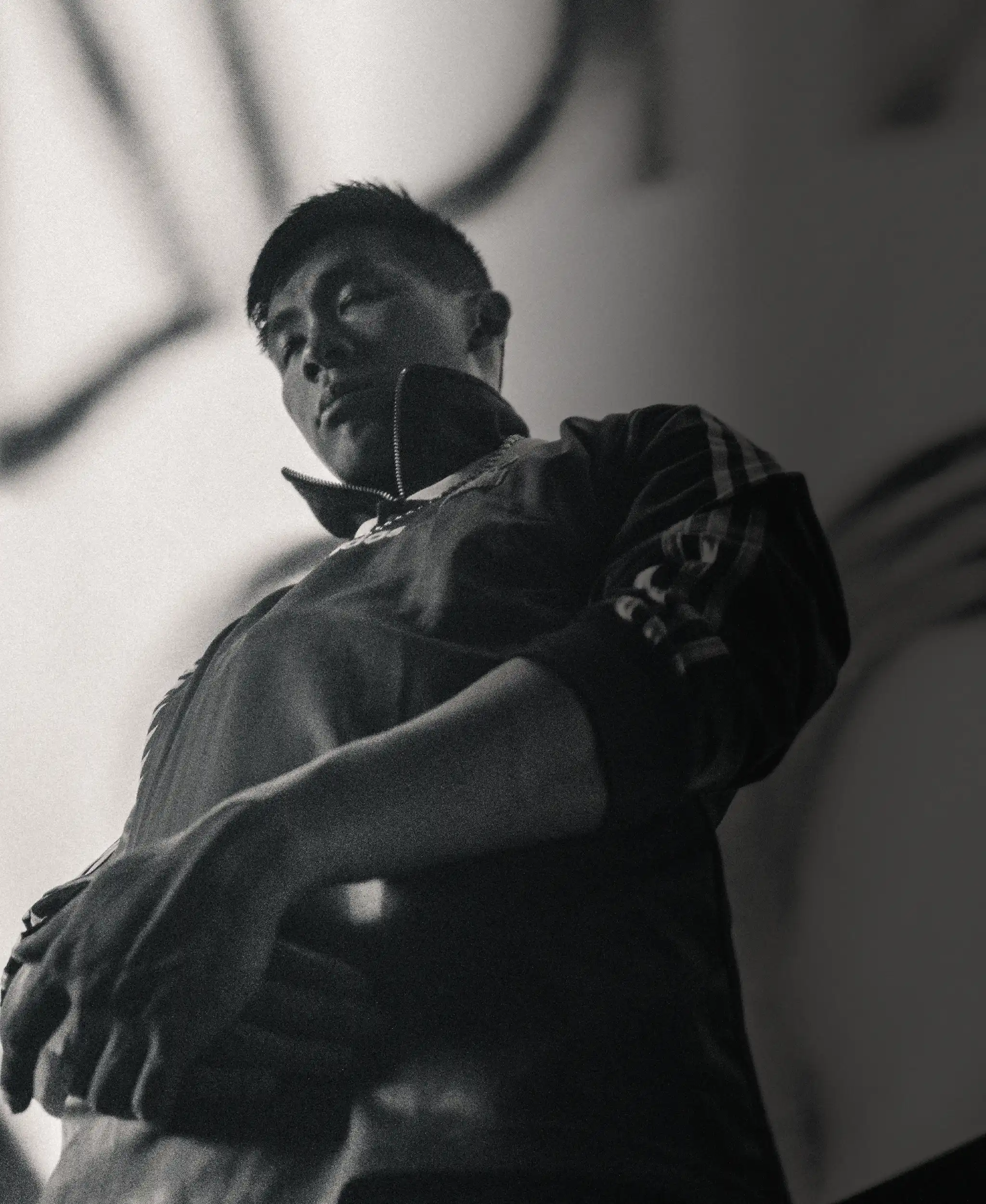 Will Innes Smith photographed in black and white by Irwin Chan on the High Volume shoot.