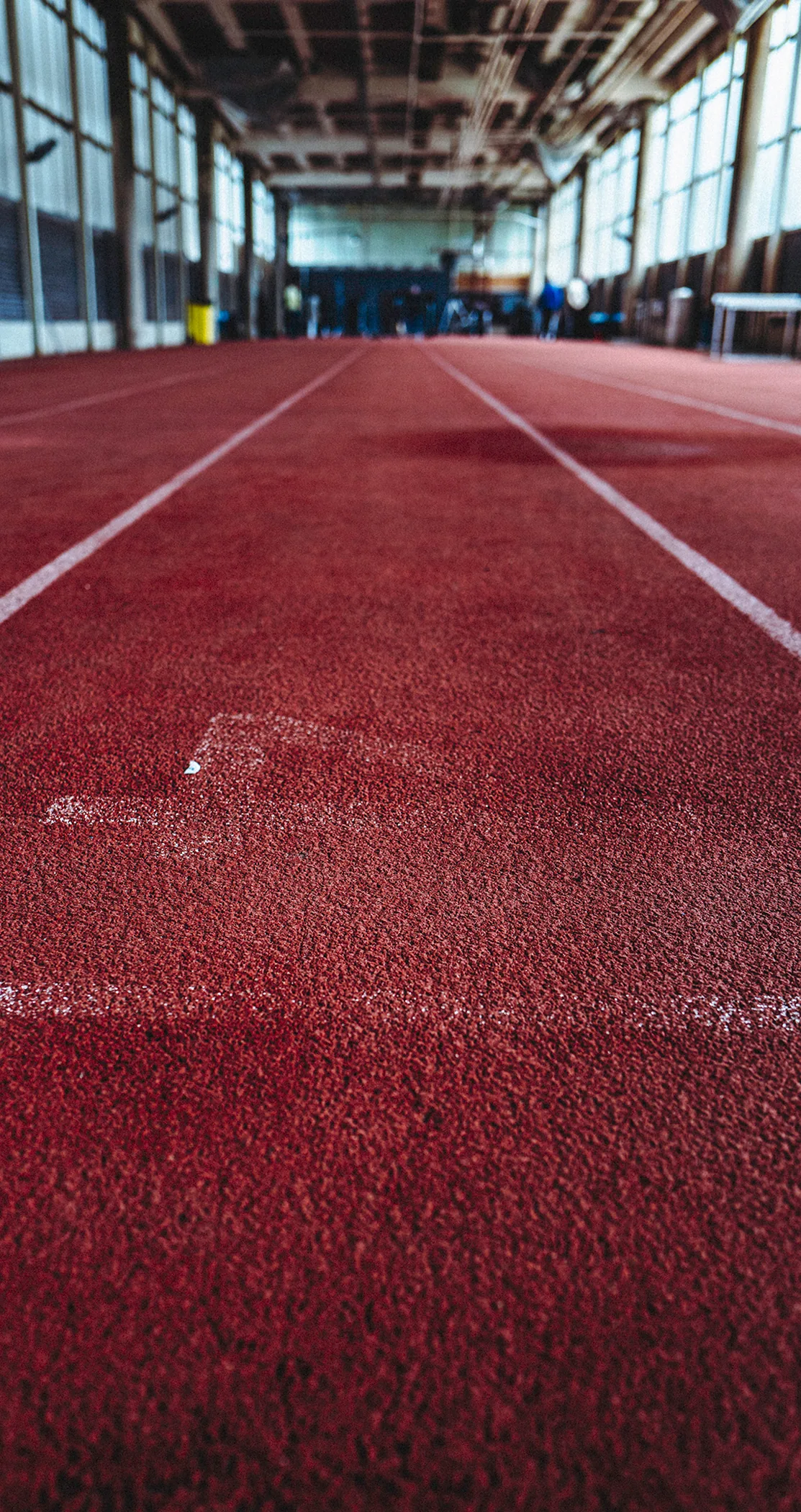 Empty red running track receding into the distance, Crystal Palace