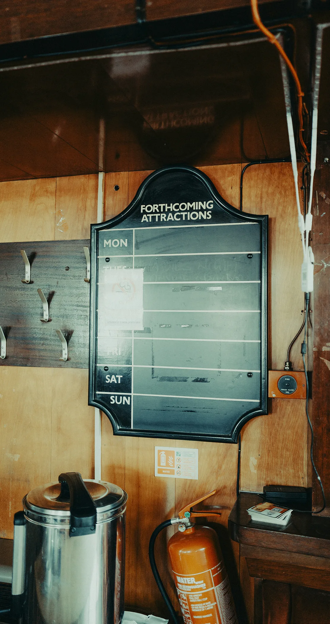 Vintage Forthcoming Attractions board on a panelled wall, Leeds